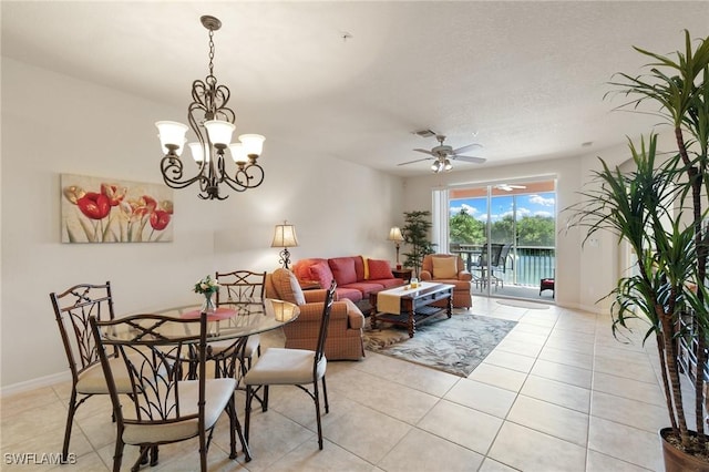 9631 Spanish Moss Way Unit 3923, Bonita Springs, FL 34135 - dining area with light tile patterned floors, a ceiling fan, baseboards, and a chandelier