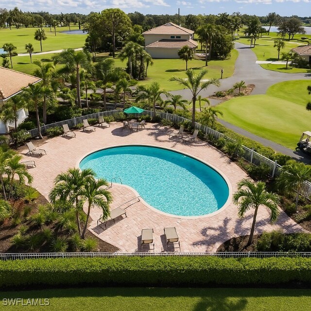 9631 Spanish Moss Way Unit 3923, Bonita Springs, FL 34135 - community pool featuring view of golf course and a patio area