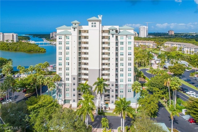 430 Cove Tower Dr Unit 501, Naples, FL 34110 - view of building exterior featuring a water view and a view of city
