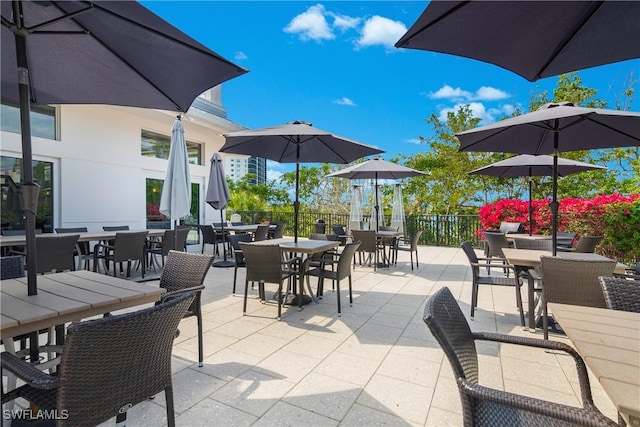 430 Cove Tower Dr Unit 501, Naples, FL 34110 - view of patio / terrace with outdoor dining area