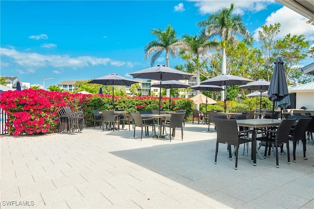 430 Cove Tower Dr Unit 501, Naples, FL 34110 - view of patio / terrace featuring outdoor dining space