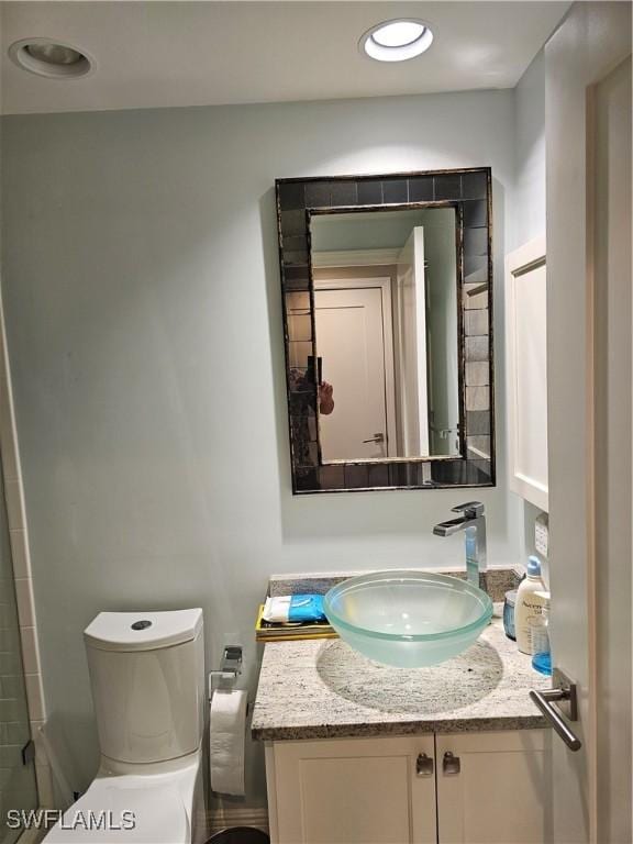 430 Cove Tower Dr Unit 501, Naples, FL 34110 - bathroom with vanity and toilet