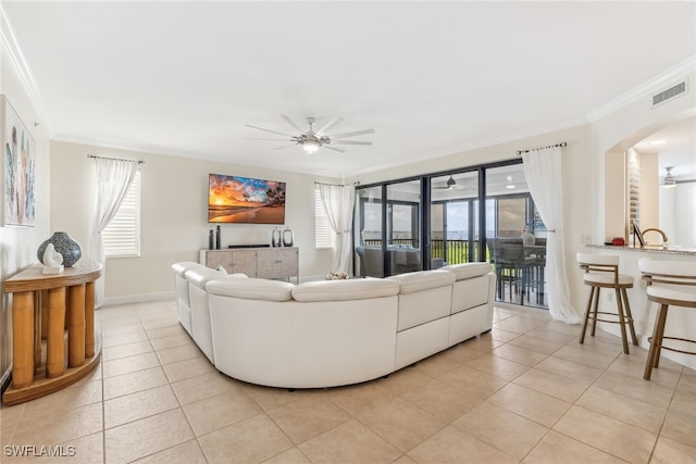 11600 Court Of Palms Unit 201, Fort Myers, FL 33908 - living room with a ceiling fan, ornamental molding, light tile patterned floors, and healthy amount of natural light
