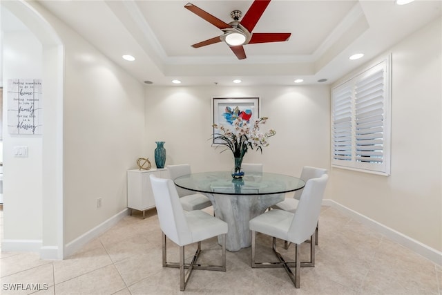 11600 Court Of Palms Unit 201, Fort Myers, FL 33908 - dining room featuring crown molding, a raised ceiling, light tile patterned floors, recessed lighting, and arched walkways