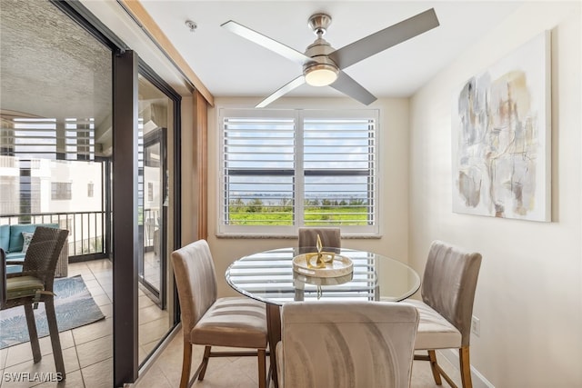 11600 Court Of Palms Unit 201, Fort Myers, FL 33908 - dining space featuring light tile patterned flooring, a ceiling fan, and baseboards
