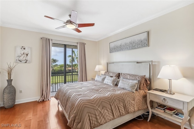 11600 Court Of Palms Unit 201, Fort Myers, FL 33908 - bedroom featuring access to exterior, wood finished floors, ornamental molding, baseboards, and ceiling fan