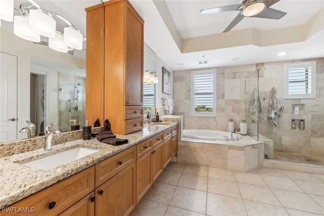 11600 Court Of Palms Unit 201, Fort Myers, FL 33908 - full bath with double vanity, a shower stall, healthy amount of natural light, and a garden tub