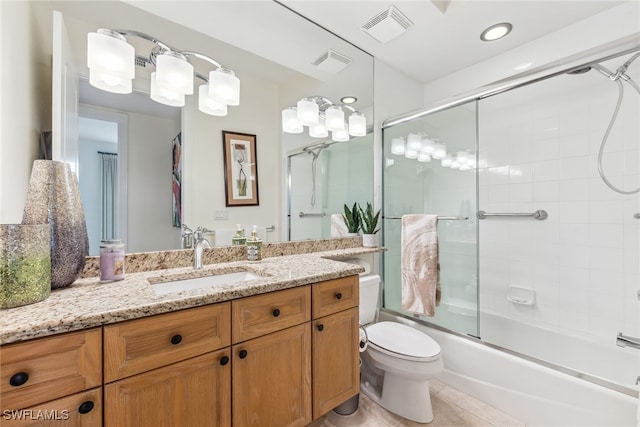 11600 Court Of Palms Unit 201, Fort Myers, FL 33908 - bathroom featuring vanity, toilet, enclosed tub / shower combo, and tile patterned flooring