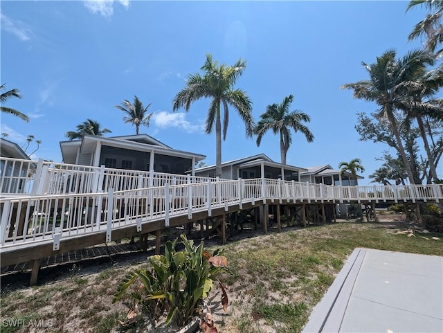 11250 Porpoise Point Rd Unit 8, Matlacha, FL 33993 - view of yard with a sunroom and a deck