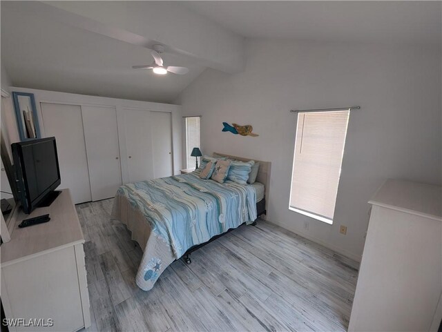 11250 Porpoise Point Rd Unit 8, Matlacha, FL 33993 - bedroom with light wood finished floors, two closets, and a ceiling fan