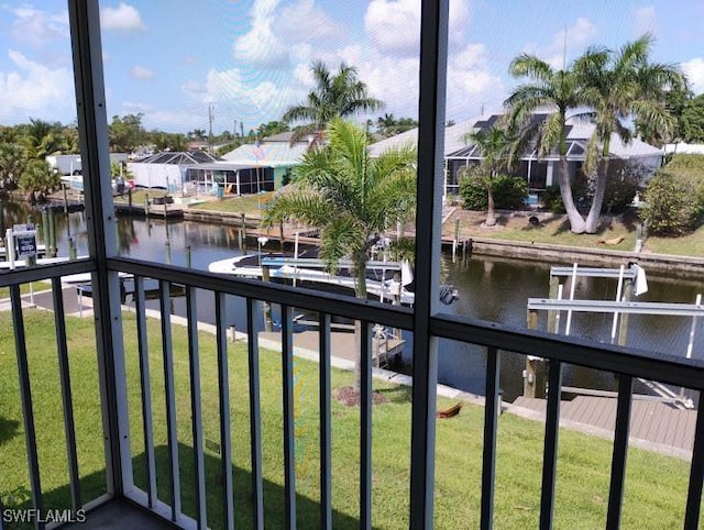 5116 Coronado Pkwy Unit 16, Cape Coral, FL 33904 - water view with nearby suburban area, boat lift, and a boat dock