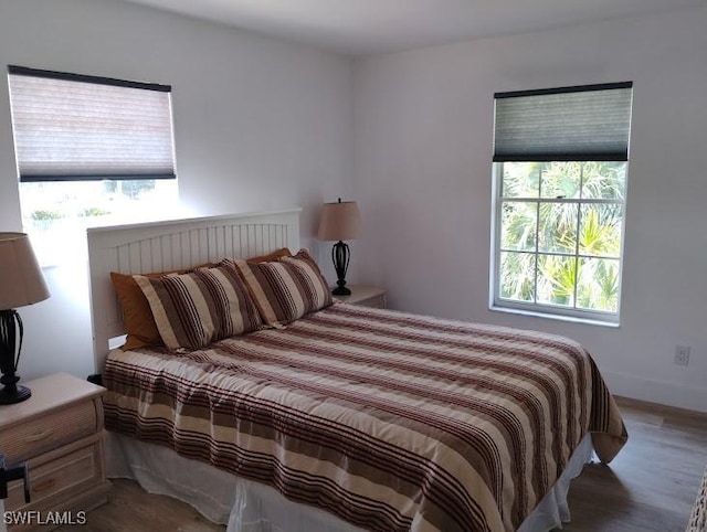 5116 Coronado Pkwy Unit 16, Cape Coral, FL 33904 - bedroom featuring wood finished floors and baseboards