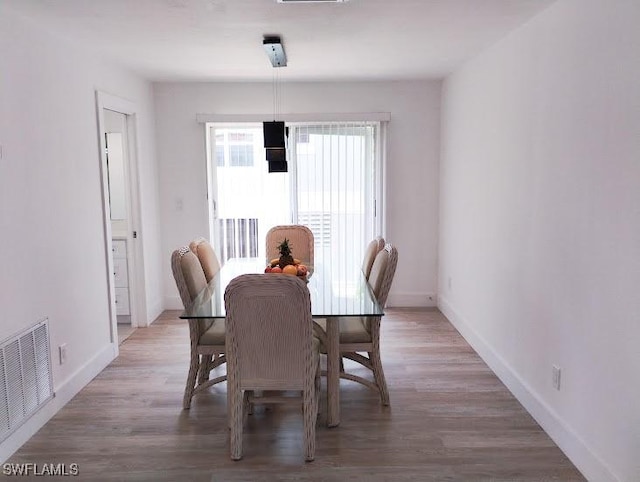 5116 Coronado Pkwy Unit 16, Cape Coral, FL 33904 - dining space featuring baseboards and wood finished floors