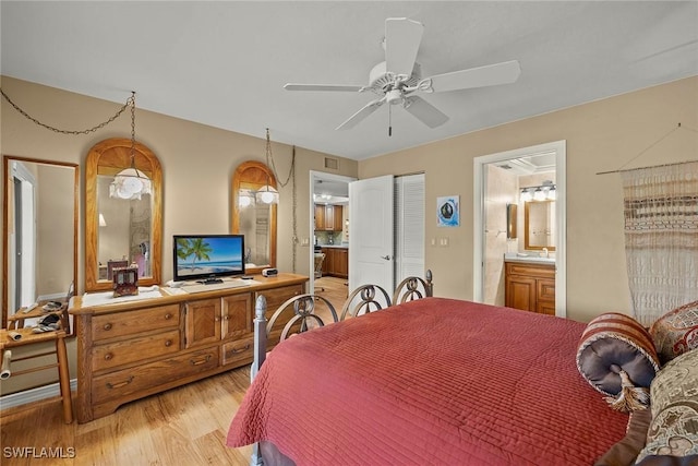 8411 Charter Club Cir Unit 1, Fort Myers, FL 33919 - bedroom featuring light wood finished floors, a sink, and connected bathroom