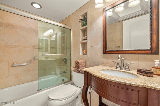 8411 Charter Club Cir Unit 1, Fort Myers, FL 33919 - full bathroom with tile walls, vanity, bath / shower combo with glass door, and toilet
