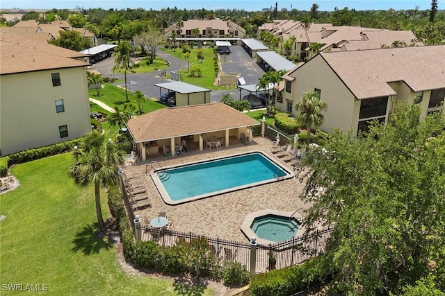 8411 Charter Club Cir Unit 1, Fort Myers, FL 33919 - community pool featuring a hot tub, a residential view, and a patio area