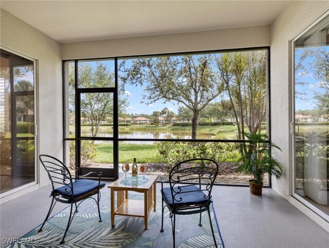 10230 Cobble Hill Rd, Bonita Springs, FL 34135 - sunroom featuring a textured wall and a water view