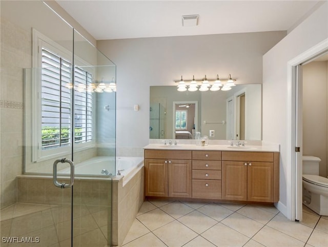 10230 Cobble Hill Rd, Bonita Springs, FL 34135 - full bath featuring tile patterned floors, double vanity, toilet, a garden tub, and a shower stall