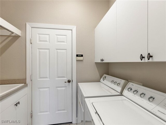 10230 Cobble Hill Rd, Bonita Springs, FL 34135 - laundry room featuring washer and clothes dryer and cabinet space