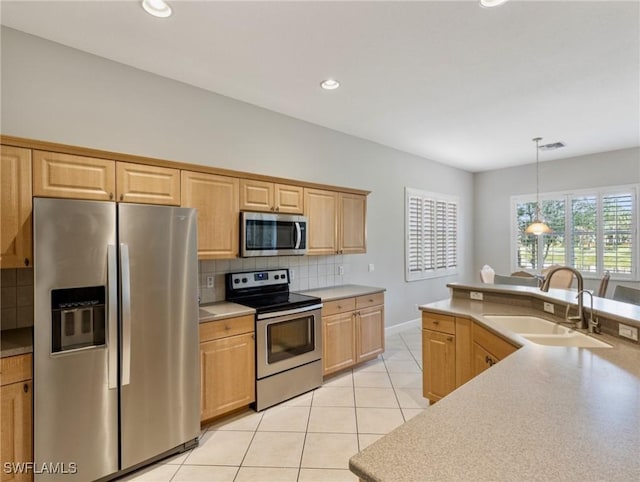 10230 Cobble Hill Rd, Bonita Springs, FL 34135 - kitchen featuring appliances with stainless steel finishes, a sink, tasteful backsplash, light tile patterned flooring, and recessed lighting
