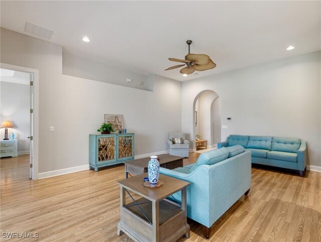 10230 Cobble Hill Rd, Bonita Springs, FL 34135 - living area with arched walkways, a ceiling fan, light wood-style flooring, baseboards, and recessed lighting