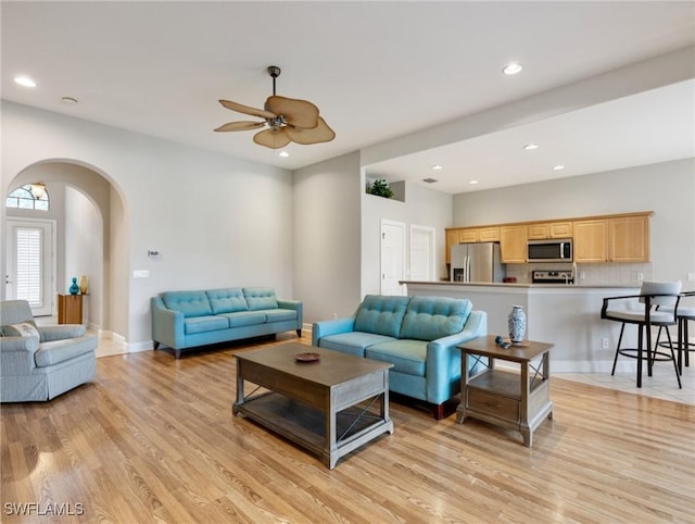 10230 Cobble Hill Rd, Bonita Springs, FL 34135 - living area with light wood-style flooring, a ceiling fan, arched walkways, recessed lighting, and baseboards