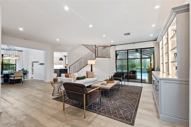 4083 Aspen Chase Dr, Naples, FL 34119 - living area with light wood-style flooring, recessed lighting, stairs, a chandelier, and baseboards