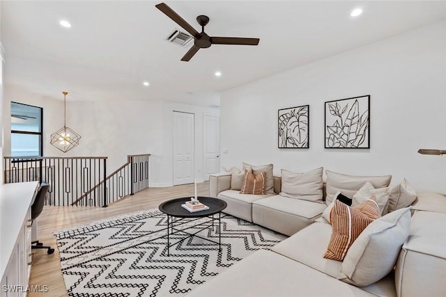 4083 Aspen Chase Dr, Naples, FL 34119 - living room with ceiling fan, recessed lighting, light wood-type flooring, and a chandelier
