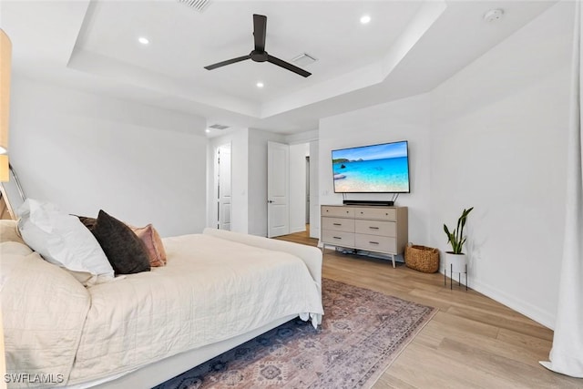 4083 Aspen Chase Dr, Naples, FL 34119 - bedroom featuring a raised ceiling, light wood-style floors, baseboards, recessed lighting, and ceiling fan