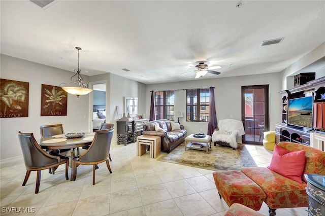 11923 Adoncia Way Unit 2802, Fort Myers, FL 33912 - living area featuring healthy amount of natural light, light tile patterned floors, and ceiling fan