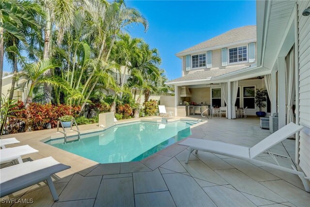 687 9th Ave S, Naples, FL 34102 - view of pool with area for grilling and a patio