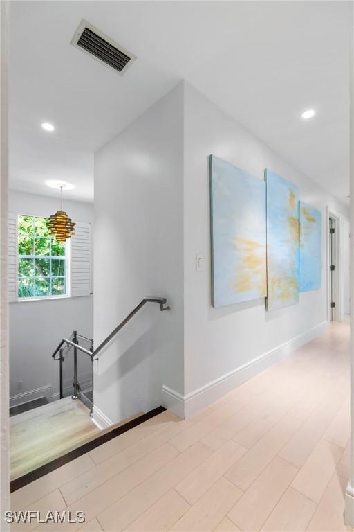 687 9th Ave S, Naples, FL 34102 - hallway featuring an upstairs landing, baseboards, and recessed lighting