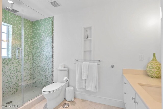 687 9th Ave S, Naples, FL 34102 - bathroom featuring toilet, a stall shower, vanity, and tile patterned flooring