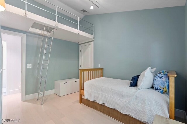 687 9th Ave S, Naples, FL 34102 - bedroom featuring wood finished floors and baseboards
