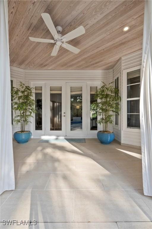 687 9th Ave S, Naples, FL 34102 - doorway to property featuring french doors, a ceiling fan, and a patio area