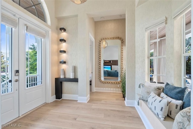 687 9th Ave S, Naples, FL 34102 - entryway with wood finished floors and baseboards