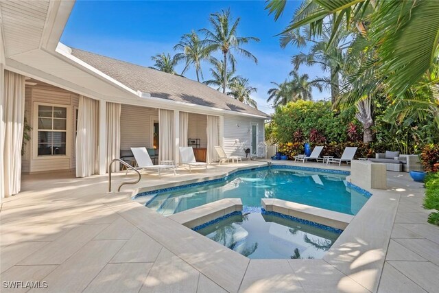 687 9th Ave S, Naples, FL 34102 - view of pool with a patio area and a pool with connected hot tub