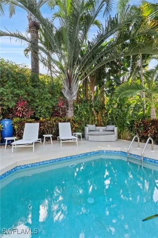 687 9th Ave S, Naples, FL 34102 - outdoor pool with a patio