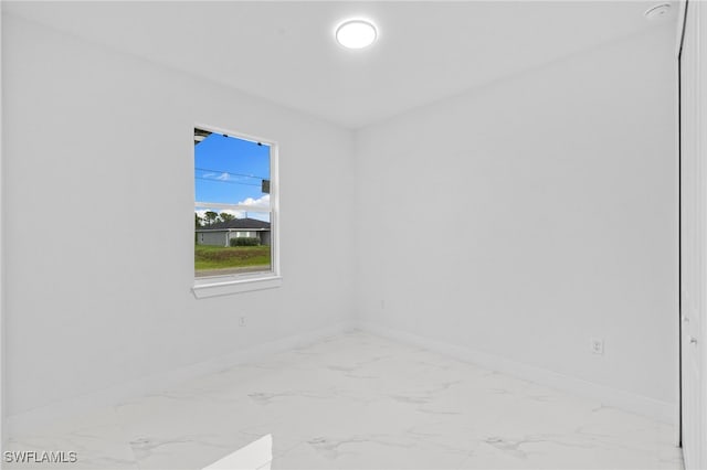 2813 38th St SW, Lehigh Acres, FL 33976 - spare room with marble finish flooring and baseboards