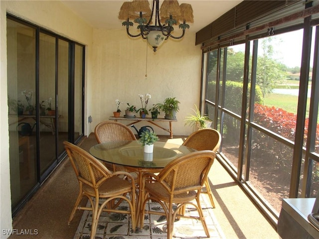 4802 Lakewood Blvd Unit B13, Naples, FL 34112 - sunroom featuring a chandelier