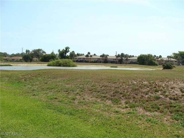 4802 Lakewood Blvd Unit B13, Naples, FL 34112 - view of green lawn with a water view
