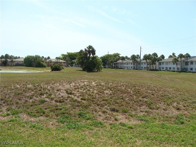 4802 Lakewood Blvd Unit B13, Naples, FL 34112 - view of grassy yard featuring a residential view