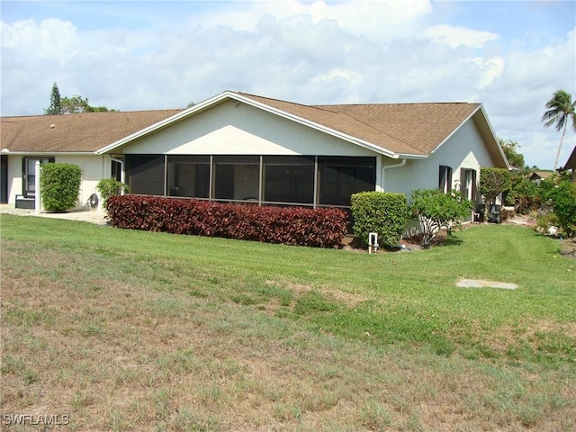 4802 Lakewood Blvd Unit B13, Naples, FL 34112 - view of side of property with stucco siding and a yard