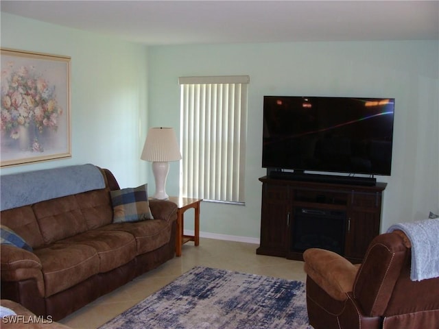 4802 Lakewood Blvd Unit B13, Naples, FL 34112 - living area with light tile patterned floors and baseboards
