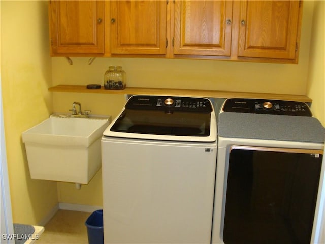 4802 Lakewood Blvd Unit B13, Naples, FL 34112 - washroom featuring washer and dryer and cabinet space