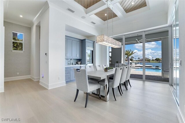 1761 Ludlow Rd, Marco Island, FL 34145 - dining space with coffered ceiling, light wood-style flooring, beam ceiling, recessed lighting, and baseboards