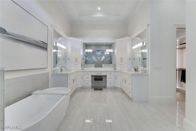 1761 Ludlow Rd, Marco Island, FL 34145 - full bath with a freestanding tub, vanity, a stall shower, a raised ceiling, and ornamental molding