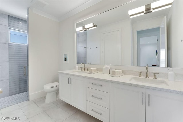 1761 Ludlow Rd, Marco Island, FL 34145 - full bath with double vanity, a shower stall, toilet, tile patterned floors, and ornamental molding