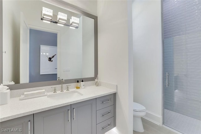 1761 Ludlow Rd, Marco Island, FL 34145 - bathroom with toilet, vanity, a stall shower, and baseboards