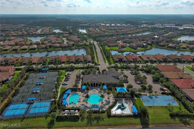 11704 Stonecreek Cir, Fort Myers, FL 33913 - aerial view of property's location featuring nearby suburban area, a nearby body of water, and a pool